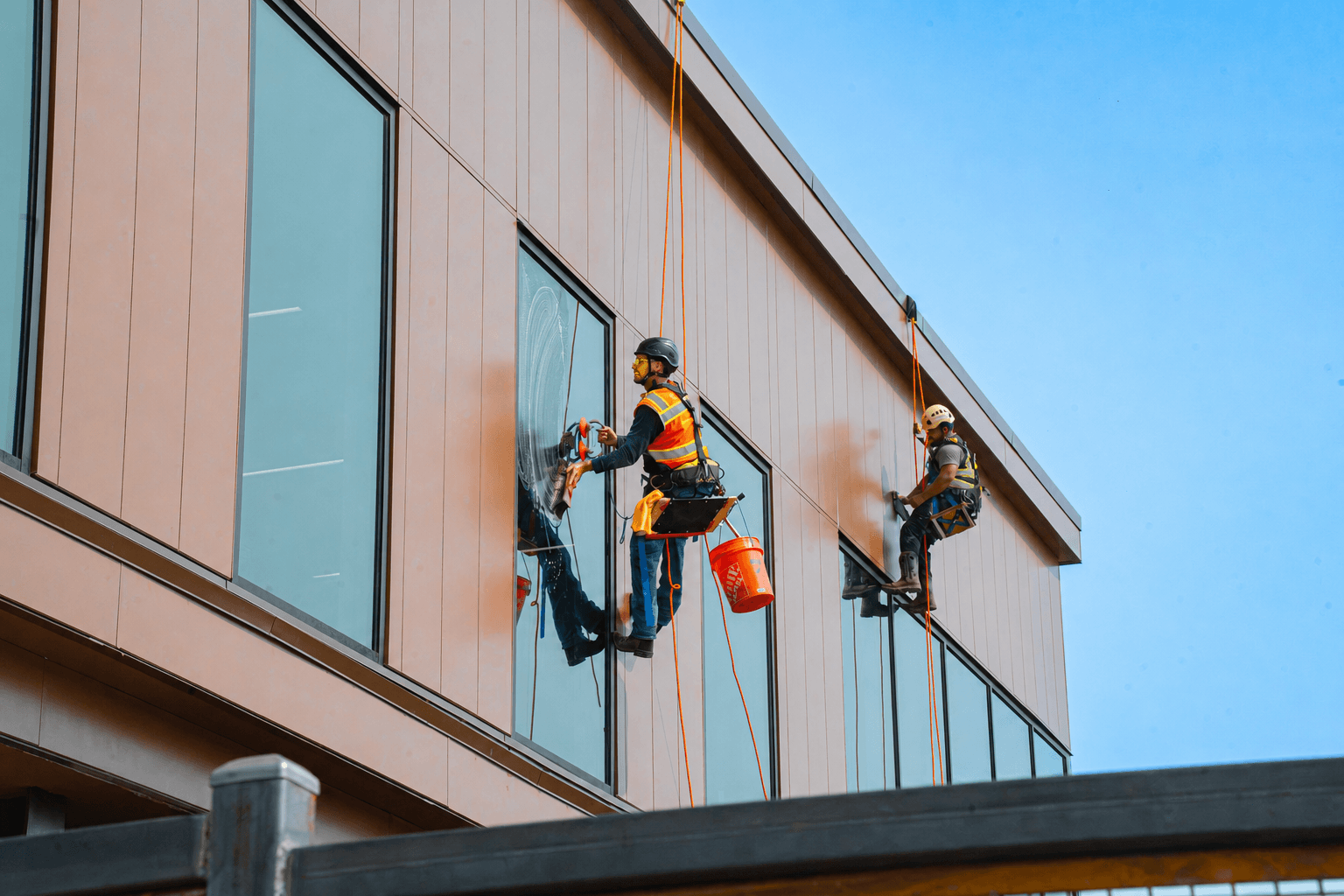 Continental Cleaning technicians cleaning building glass